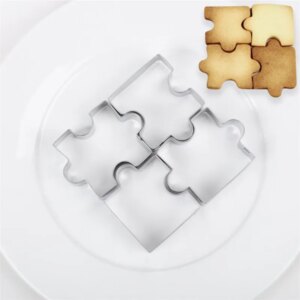 Emporte-pièces puzzle en acier inoxydable 3D dans un assiette